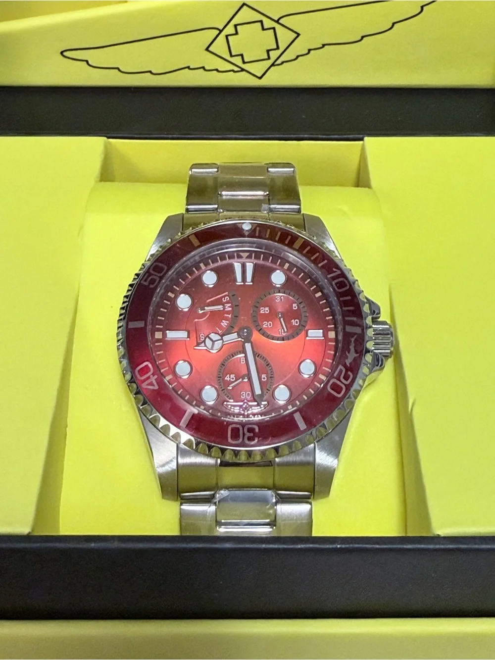 Invicta Pro Diver series stainless steel watch featuring a striking red dial